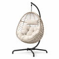 Sedia sospesa in rattan sintetico con cuscino beige